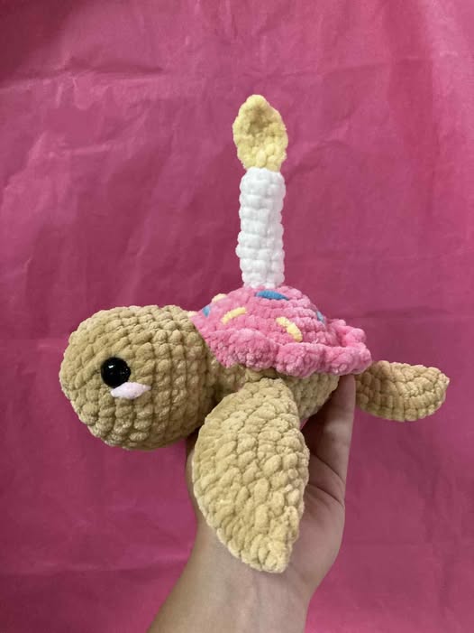 Crocheted birthday turtle with party hat
