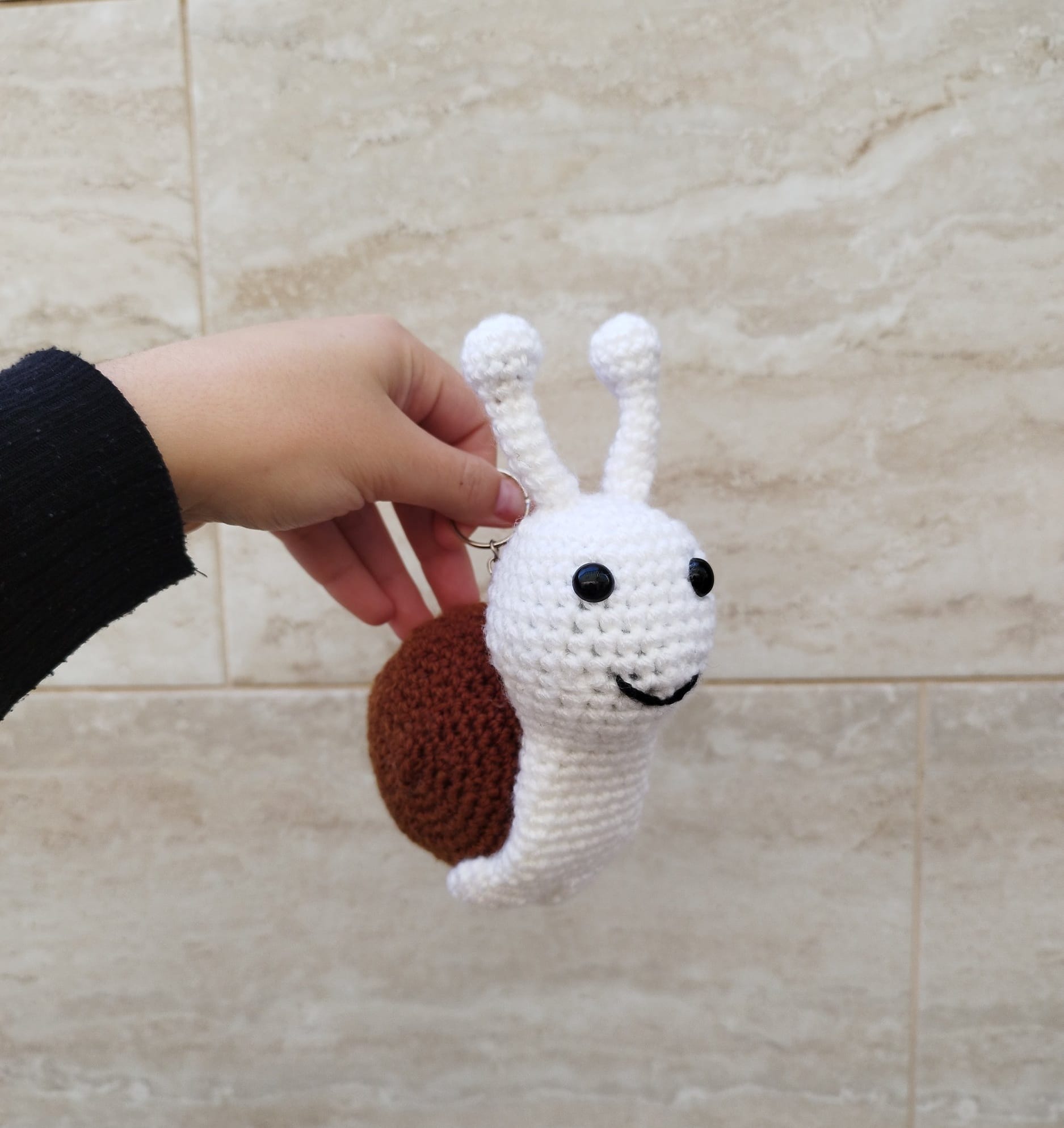 Crocheted snail keychain
